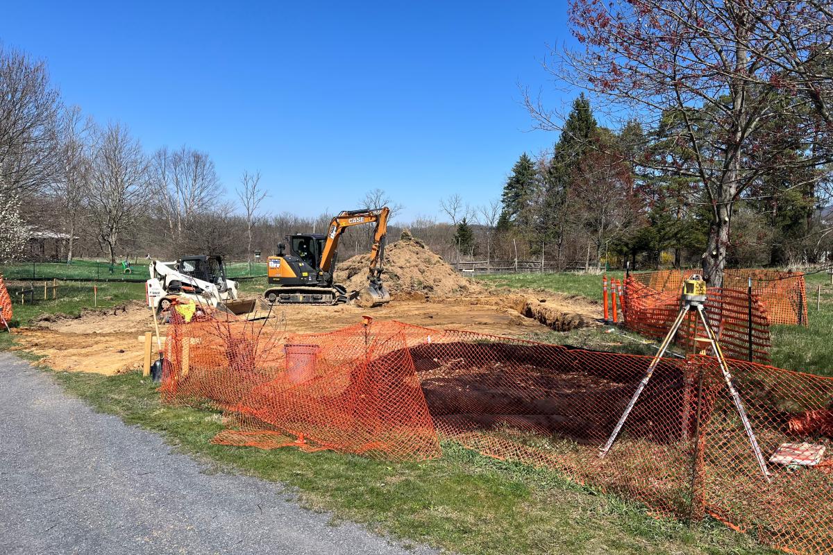 Beginning stages of excavating and removing dirt to build a level foundation on April 10th.