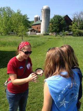 Naturalist showing children a specimen